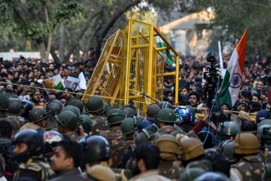 Protesters scuffle with police outside after a suspected Hindu nationalist  live-streamed himself minutes before opening fire on university students protesting against India's new citizenship law
