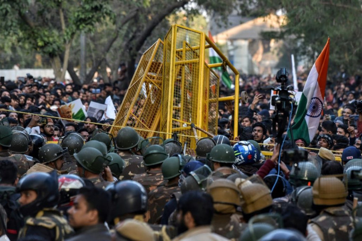 Protesters scuffle with police outside after a suspected Hindu nationalist live-streamed himself minutes before opening fire on university students protesting against India's new citizenship law