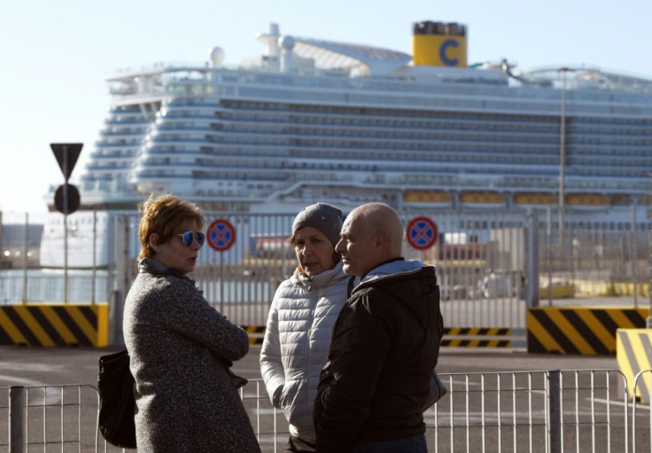 A 54-year old woman from Macau has been put in solitary confinement in the on-board hospital with her travel companion