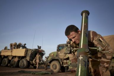 A French soldier of the French Army adjusts the coordinates of a mortar at a temporary base in northern Burkina Faso in November 2019