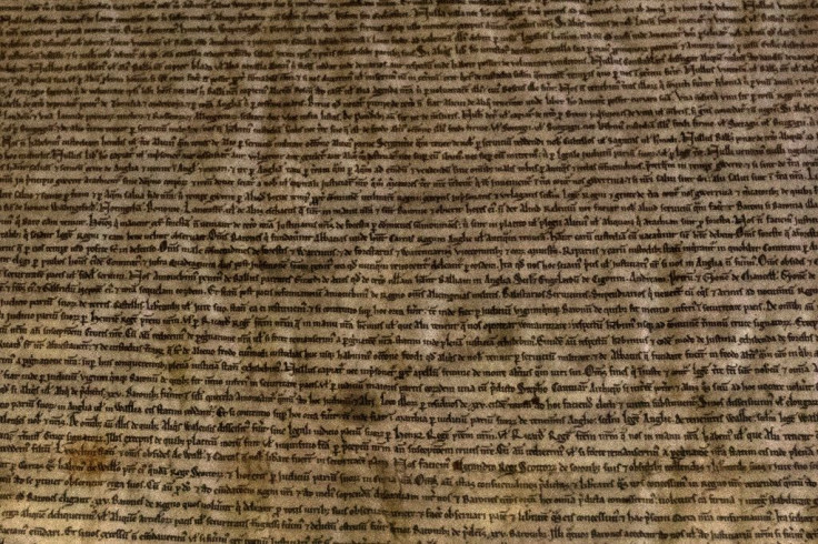 Lines of manuscript are seen in the Salisbury Cathedral 1215 copy of the Magna Carta while it was displayed at the Houses of Parliament in London in February 2015