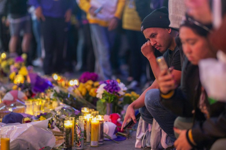 Fans visit a makeshift memorial to Kobe Bryant near Staples Center, where the Los Angeles Lakers will play their first game since the franchise legend's death when they host the Portland Trail Blazers on January 31