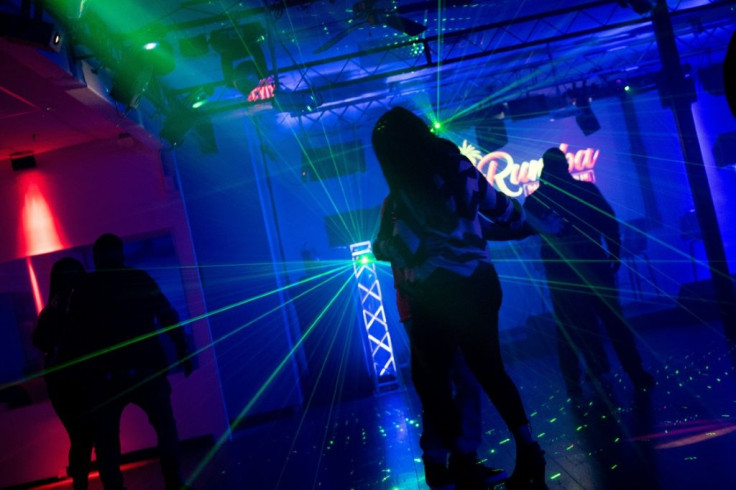 People dance at the Latino-themed La Rumba Night Club and Bar in Iowa City, Iowa