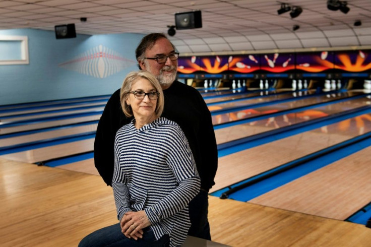 Owners Jeannie D'Agostino and her husband Richard D'Agostino pose at Sheffield Lanes bowling alley they own in Aliquippa, Pennsylvania