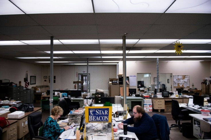 Reporters Shelley Terry and Brian Haytcher work at the Star Beacon newspaper in Ashtabula, Ohio, which keeps publishing daily despite the shrinking market for print media