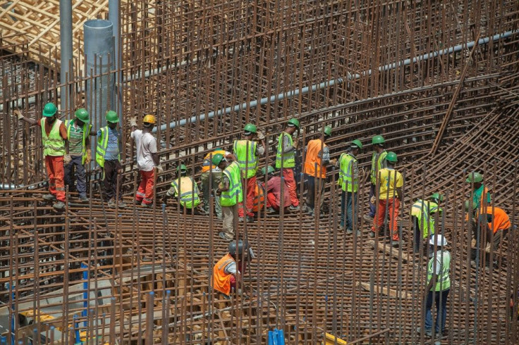 Ethiopian workers stand on scaffolding in 2015 during the construction of the Grand Renaissance Dam