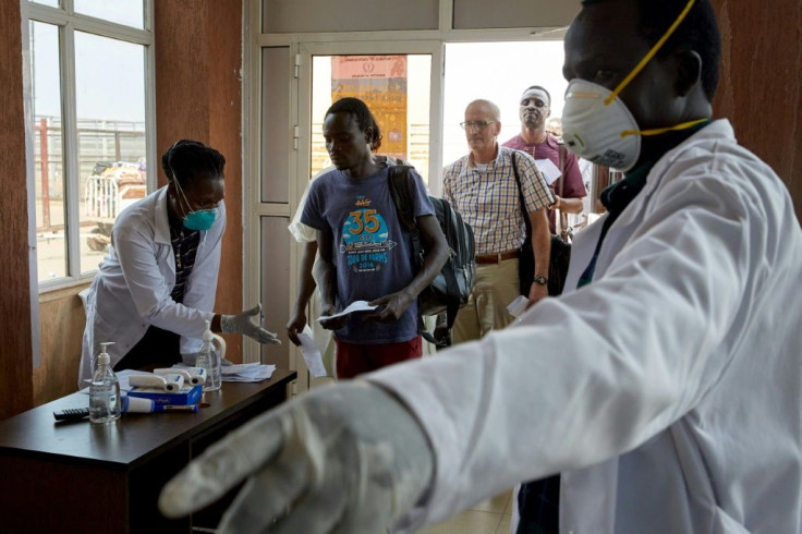 Passengers from an international flight being screened at Juba International Airport in South Sudan