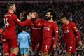 22 reasons to cheer: Mohamed Salah (2nd right) and Jordan Henderson (left) scored in Liverpool's victory over Southampton