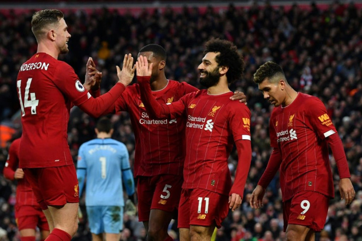 22 reasons to cheer: Mohamed Salah (2nd right) and Jordan Henderson (left) scored in Liverpool's victory over Southampton