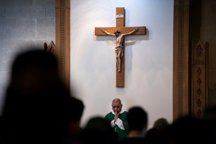 The Very Rev. Rudolph Juarez begins Spanish-language mass at St. Joseph Catholic Church in Iowa's first majority-Latino town of West Liberty