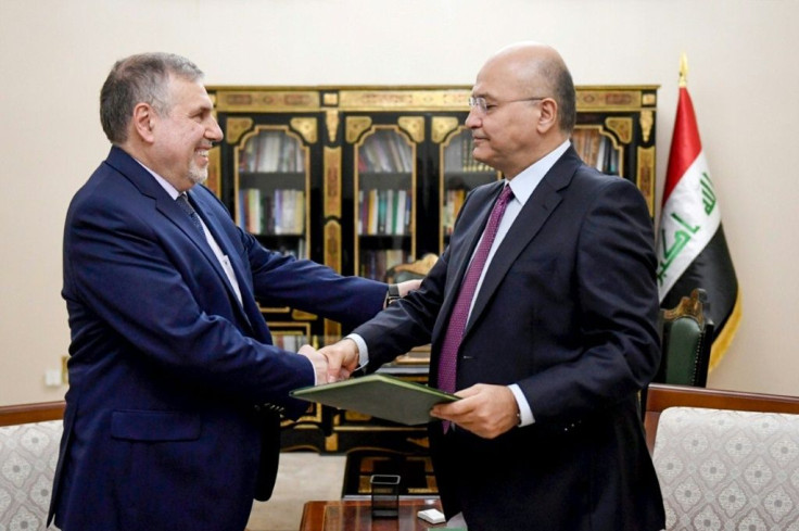 Iraqi President Barham Saleh (R) presented Allawi with the decree to appoint him as Iraq's new prime minister on February 1, 2020