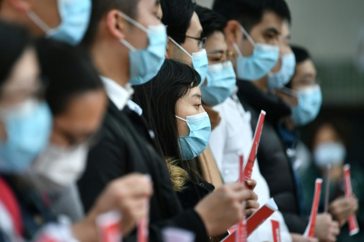 Hundreds of Hong Kong medical workers have gone on strike demanding a closure of the border with mainland China to reduce the spread of the new coronavirus