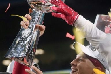 Kansas City quarterback Patrick Mahomes hoists the Vince Lombardi Trophy after the Chiefs' Super Bowl win over the San Francisco 49ers