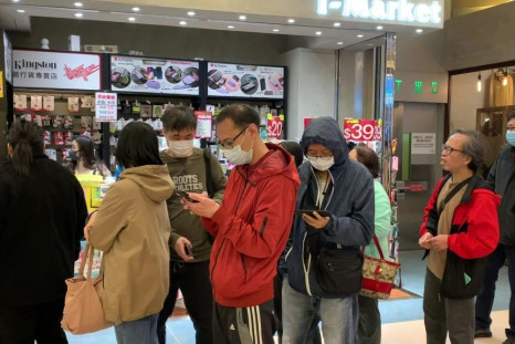 Long queues form at pharmacies in Hong Kong as fears spread through the crowded metropolis over China's new coronavirus epidemic.