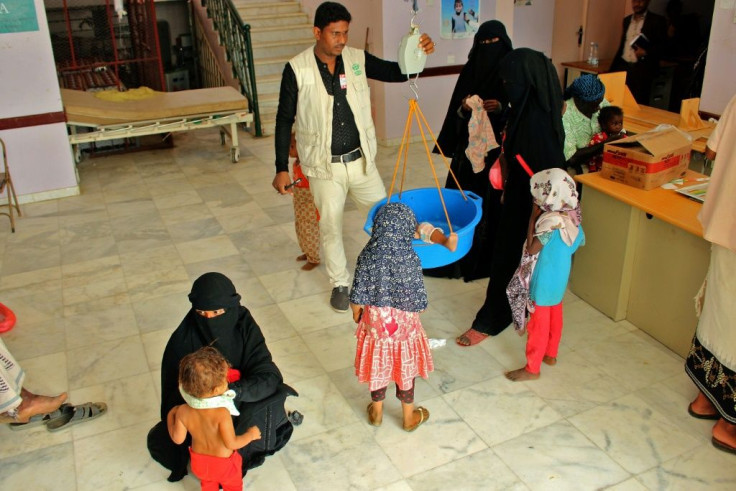 Children suffering from malnutrition receive treatment at a clinic in Yemen's northern Hajjah province
