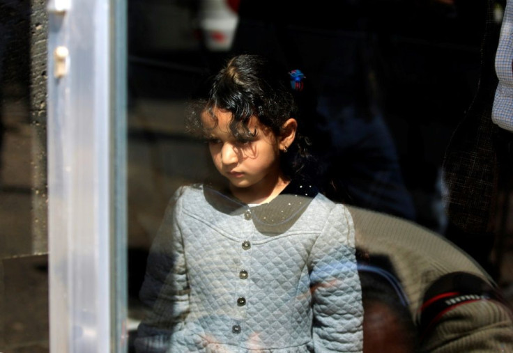 A sick Yemeni child waits for evacuation on a UN-marked humanitarian flight from Sanaa airport for medical treatment in Amman