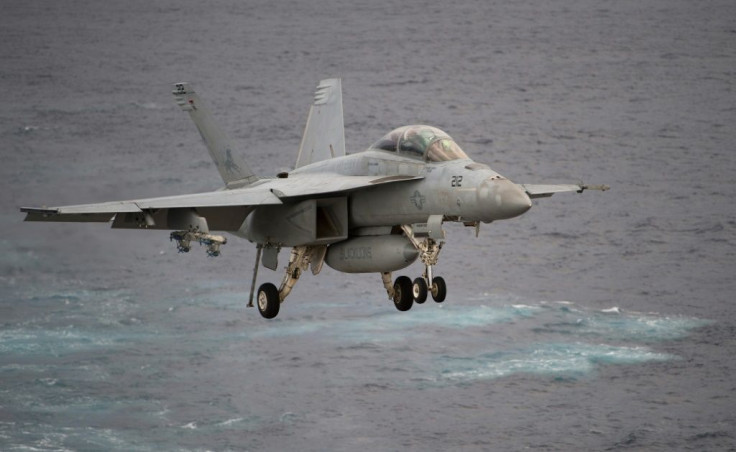 A Boeing EA-18G Growler lands on the deck of the USS George H.W. Bush aircraft carrier in the Atlantic ocean on October 25, 2017