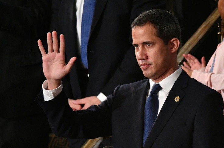 Venezuelan opposition leader Juan Guaido waves as he is acknowledged by US President Donald Trump during the State of the Union address