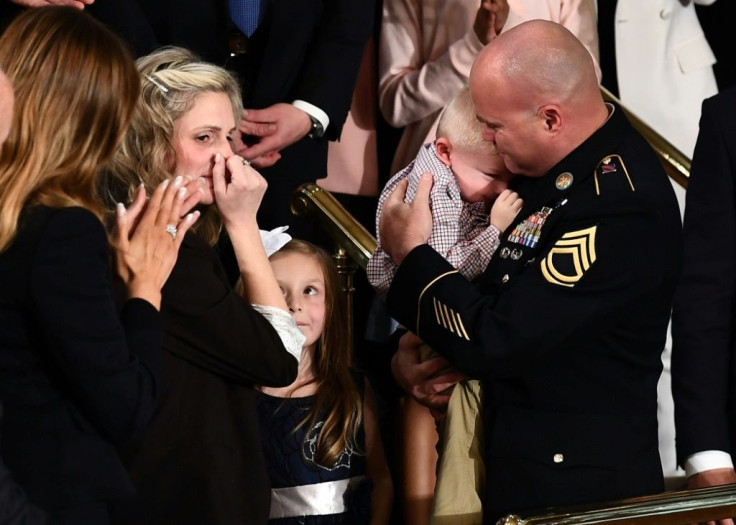Sgt Townsend Williams, returning from deployment in Afghanistan, was reunited with his wife Amy and baby son during the State of the Union address