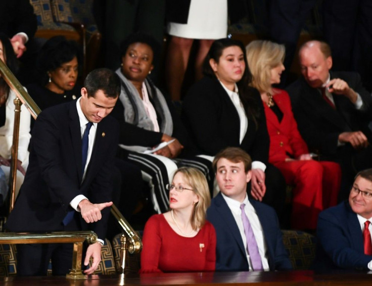 Venezuelan opposition leader Juan Guaido makes a gestures before the start of the State of the Union address