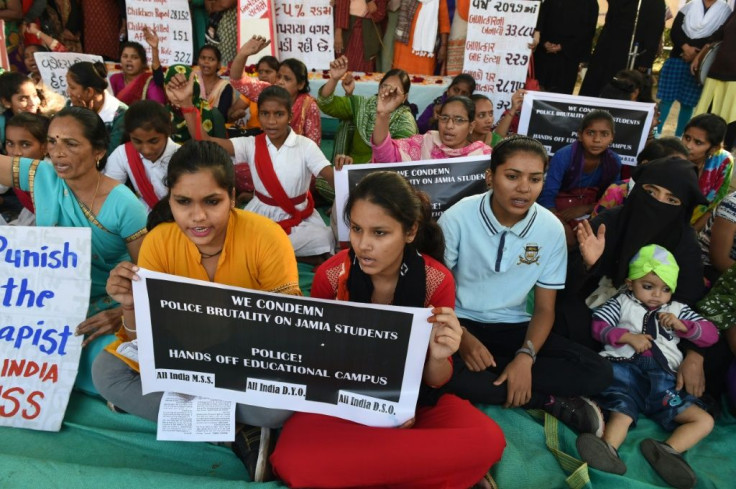Students hold placards during 'Nirbhaya Day' to mark the anniversary of the brutal rape case of a 23-year-old physiotherapy student on a bus in New Delhi in 2012