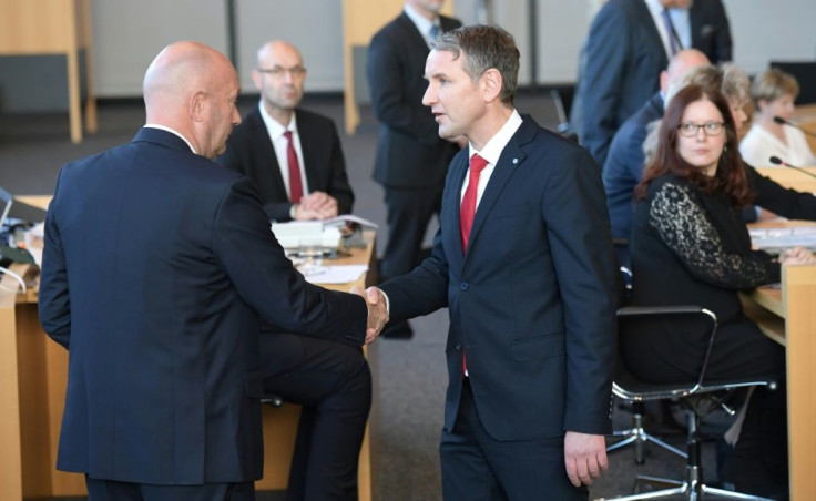 Bjoern Hoecke, chairman of far-right AfD group in the eastern state of Thuringia (R) congratulates Free Democrat Thomas Kemmerich (L), newly elected regional leader, with AfD help