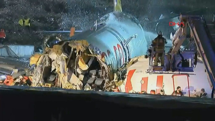 IMAGESEmergency worker are hosing down part of a plane that skid off a runway in Istanbul.