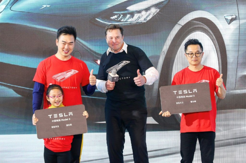 Tesla CEO Elon Musk (C), shown in Shanghai last month, has enjoyed a positive run in recent months at the expense of Detroit's Big Three