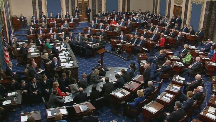 Senators voting during the impeachment trial of the US president in the Senate Chamber at the US Capitol