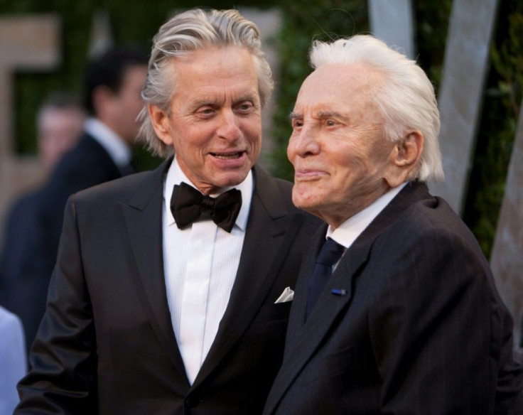 Michael Douglas (left) is pictured in 2012 with his father Kirk, whom he described as "leaving a legacy in film that will endure for generations"