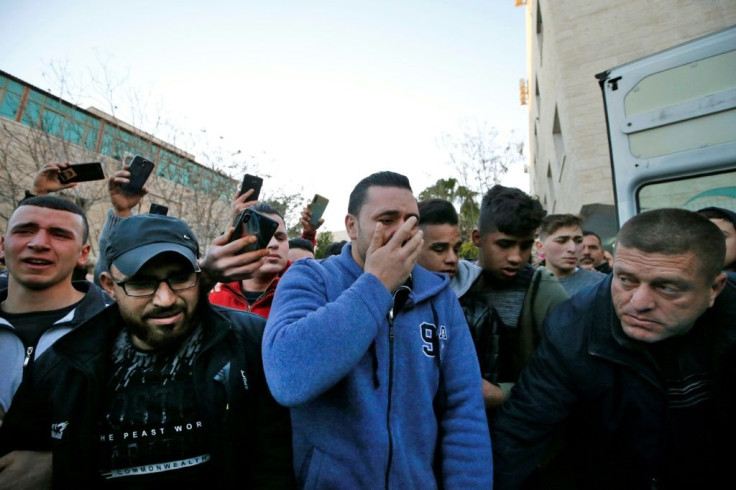 Relatives mourn Palestinian teenager Mohammed al-Haddad, killed by Israeli fire during clashes in the flashpoint West Bank city of Hebron on Wednesday