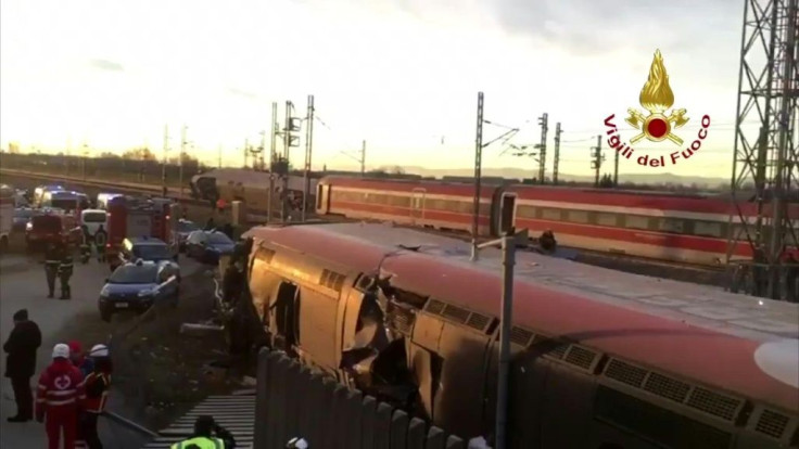 IMAGESMembers of rescue teams arrive on site of derailed train in Italy. Two people were killed and about 25 injured when the high-speed train derailed near Milan. According to initial findings reported by the media, the train went off the rails and struc