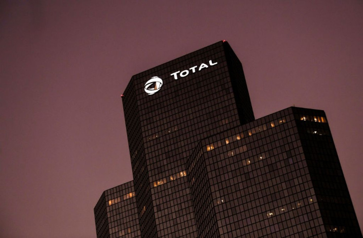 Shares in Total outpaced gains in the wider Paris market after the oil firm said profits held relatively steady last year