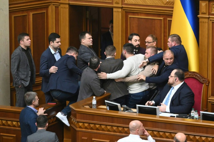 Around 15 Ukrainian lawmakers from President Zelensky's party and their opponents Tymoshenko pushed each other near the parliament's rostrum