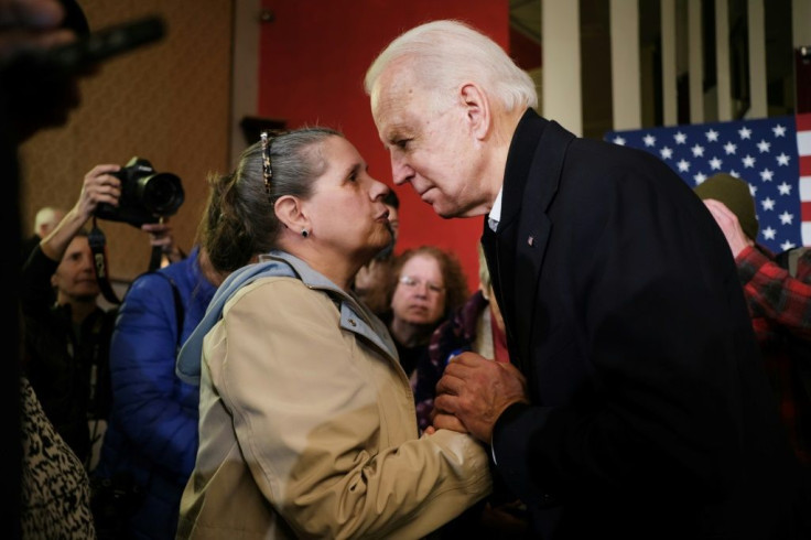 Democratic presidential candidate Joe Biden speaks to a supporter in Somersworth, New Hampshire