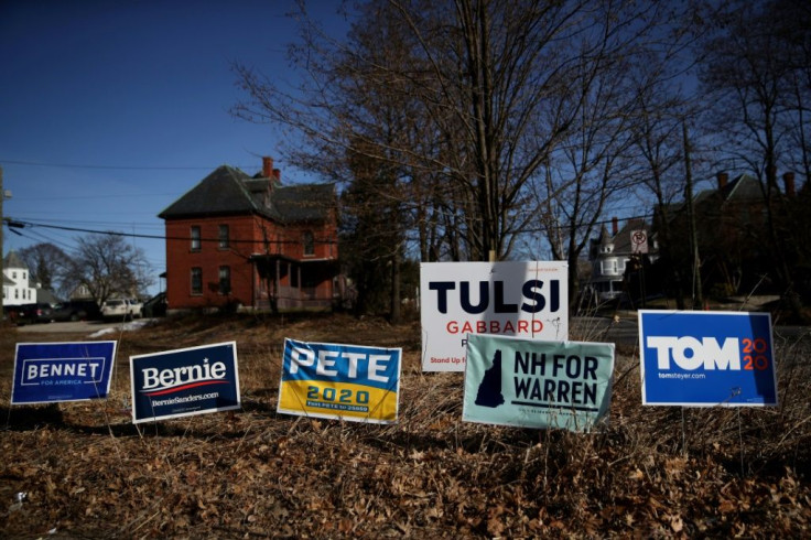 Yard signs for Democratic presidential candidates in front of a home in Manchester, New Hampshire