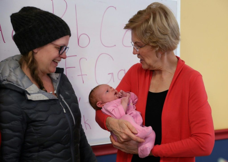Democratic presidential candidate Elizabeth Warren holds a baby during a campaign stop in Exeter, New Hampshire