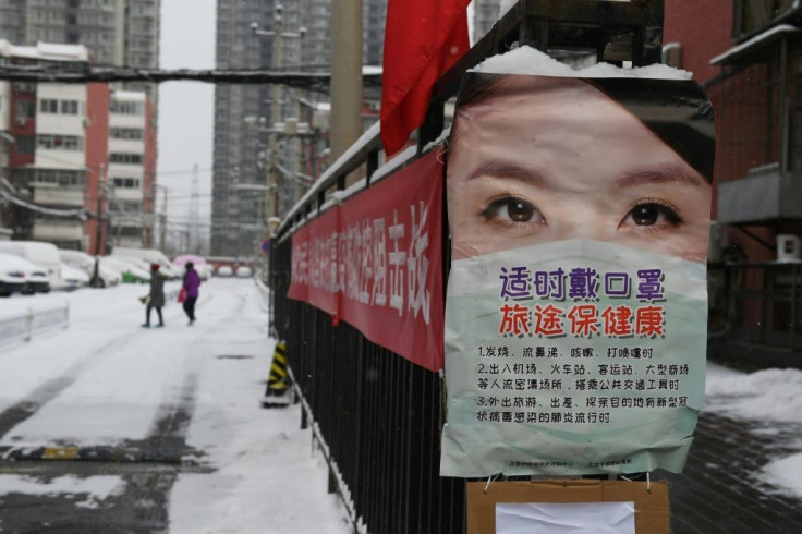 Posters warn residents in Beijing to take protective measures against the coronavirus