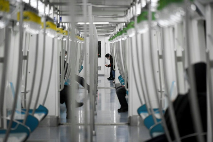 A nearly empty subway carriage in Beijing. China has postponed the return to school, cut bus and train routes, and tightened health screening on travellers nationwide