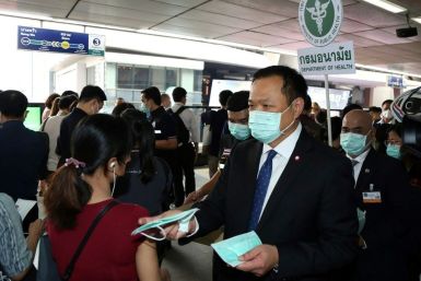 Health Minister Anutin Charnvirakul (R) suggested 'Western' tourists not wearing face masks should be kicked out of the county