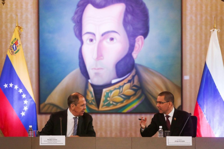 Russian Foreign Minister Sergei Lavrov (L) speaks with his Venezuelan counterpart Jorge Arreaza (R) at the Foreign Affairs Ministry in Caracas on February 7, 2020