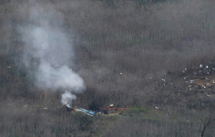 Smoke rises from the site of the helicopter crash in Calabasas, California, on January 26 that killed NBA icon Kobe Bryant, his daughter Gianna and seven others. The NTSB says there is no indication that engine failure was a factor