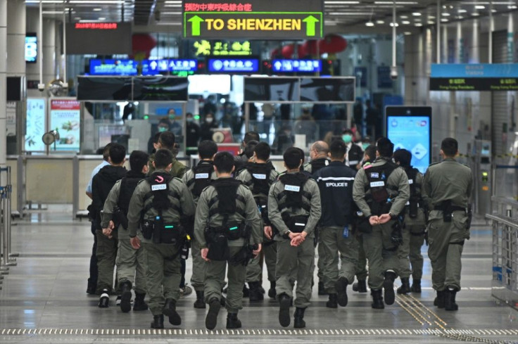 Hong Kong police patrol a border crossing after strict quarantine measures were imposed on city visitors to curb the spread of the new coronavirus