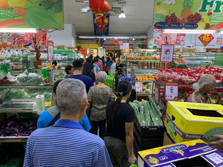 People rushed to stock up on items including rice, noodles and toilet paper, although the government said there was no risk of a shortage
