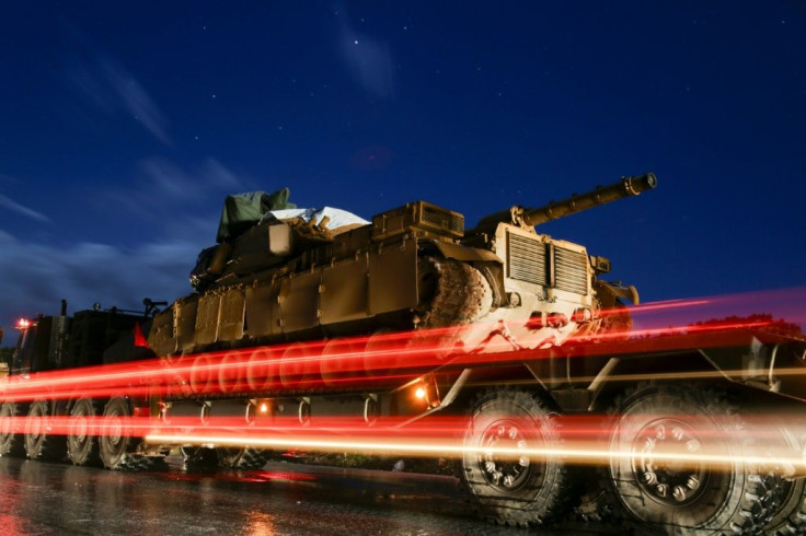 Turkey has deployed 350 vehicles with commandos backed by armoured vehicles to reinforce observation outposts in the Syrian opposition bastion of Idlib