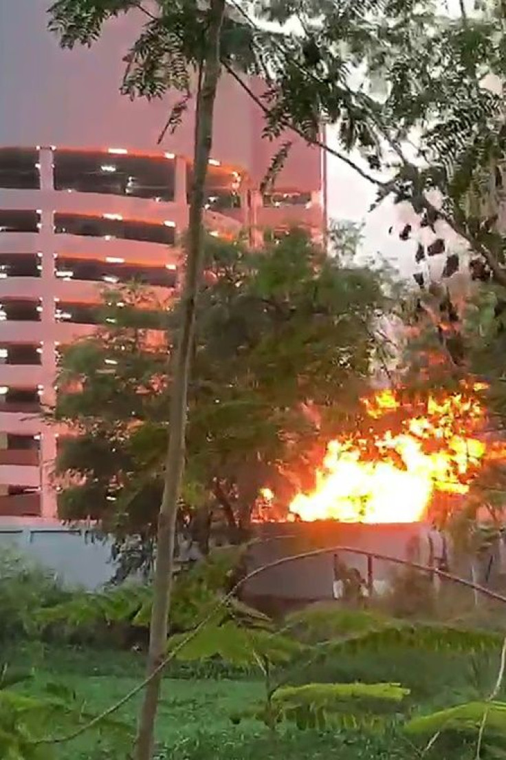 This screenshot from a handout video released by Thai oolice shows a fire on the compound of the Terminal 21 shopping mall during a shooting