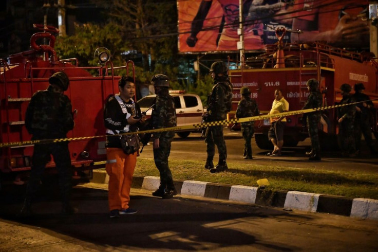 Street lights below the Teminal 21 shopping mall were switched off as soldiers and police sealed off the area