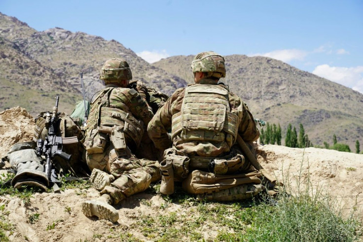 In this file photo taken on June 6, 2019, US soldiers look out over hillsides in Nerkh district of Wardak province; US and Afghan troops have come under "direct fire" in eastern Afghanistan, a US military official says