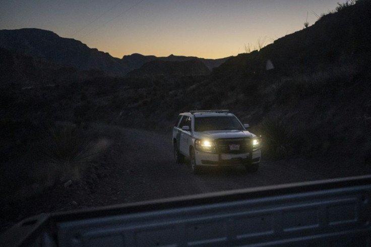 A Border Patrol vehicle drives at dusk in the Big Bend sector near Ruidosa, Texas