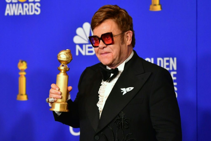 British musician Elton John -- seen here with his Golden Globe for a new song from biopic "Rocketman" -- is favored to win an Oscar as well, and will perform at the gala